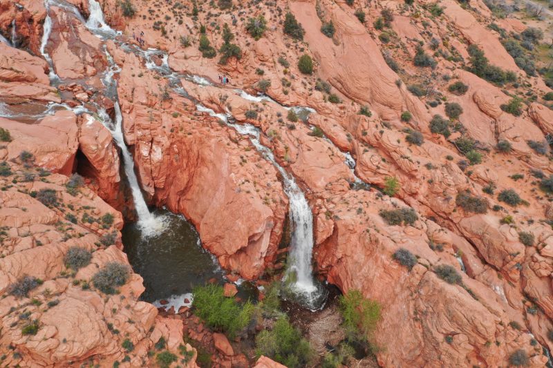 aerial overhead view of red rocks and waterfalls