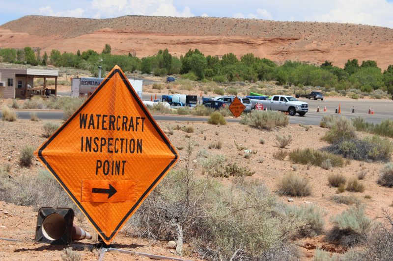 watercraft inspection point sign stationed at lake powell parking area