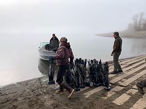 people setting up an artificial habitat in pineview reservoir