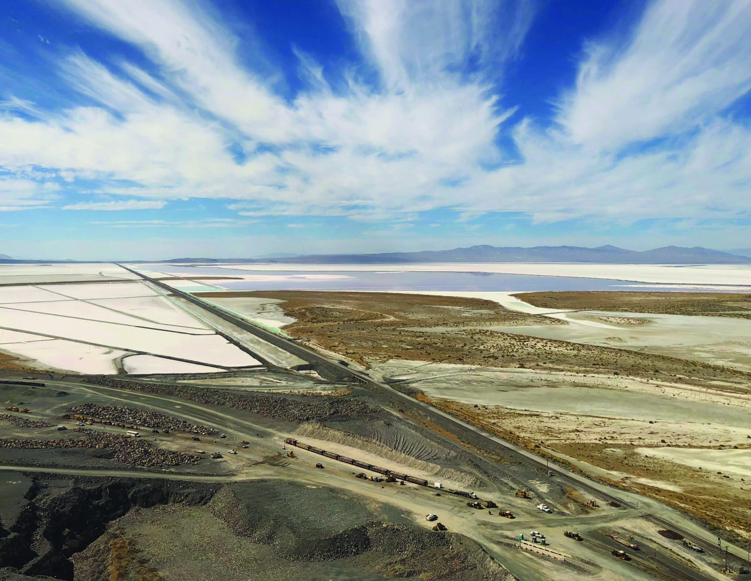 far aerial view of great salt lake and product mines