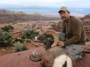 Interim DWR Director Mike Fowlks. An avid sportsman, here he is with a bighorn sheep ram he took in 2010. Photo courtesy of DWR